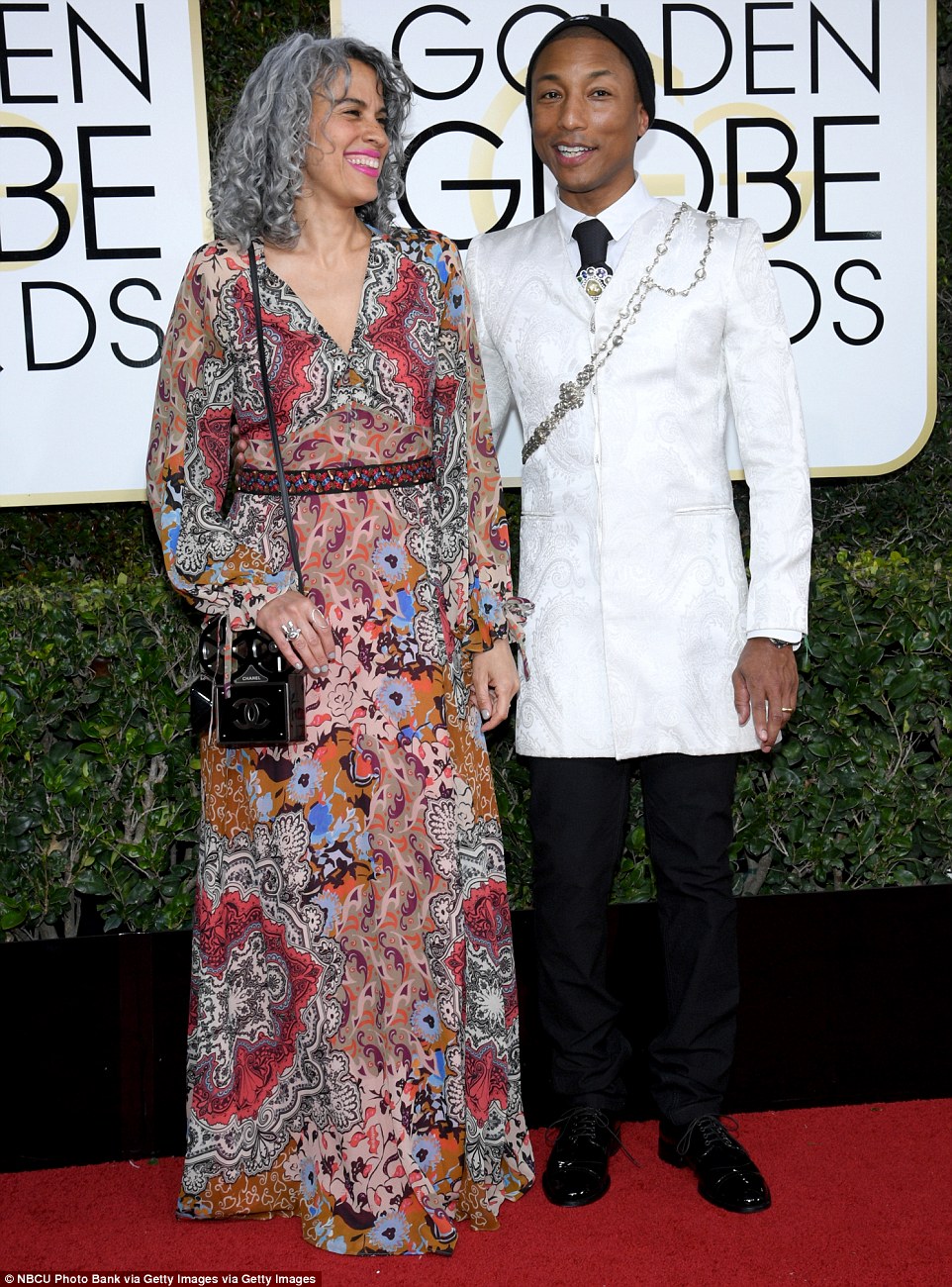 3bf7bd9300000578-4100390-quite_a_pair_pharrell_williams_and_his_wife_helen_lasichanh_came-m-116_1483927575392